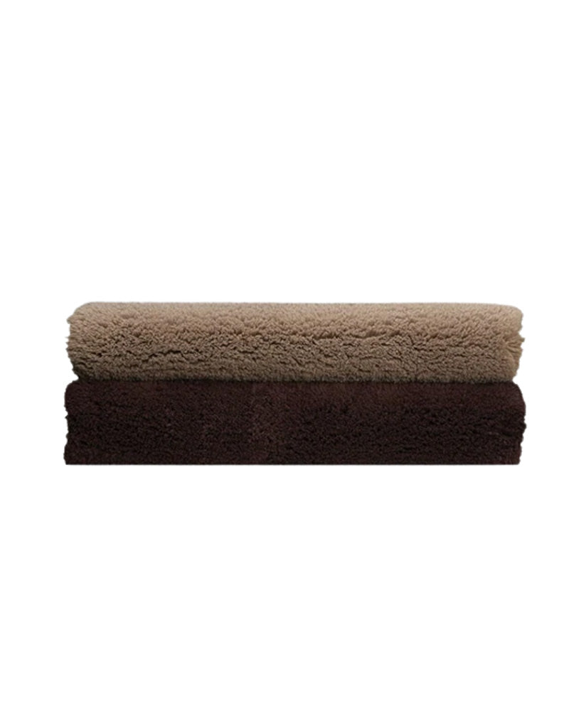two brown bath mats on top of each other