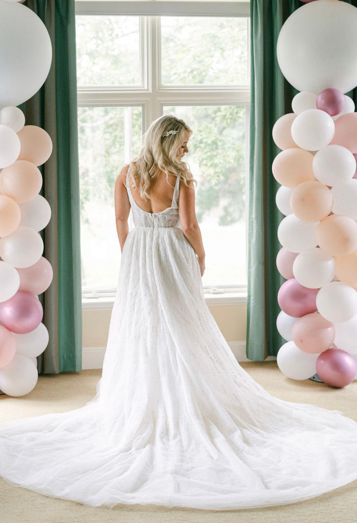 Beau Gown | V-neck natural waist A-line gown with beaded white pearls and clear crystal sequins