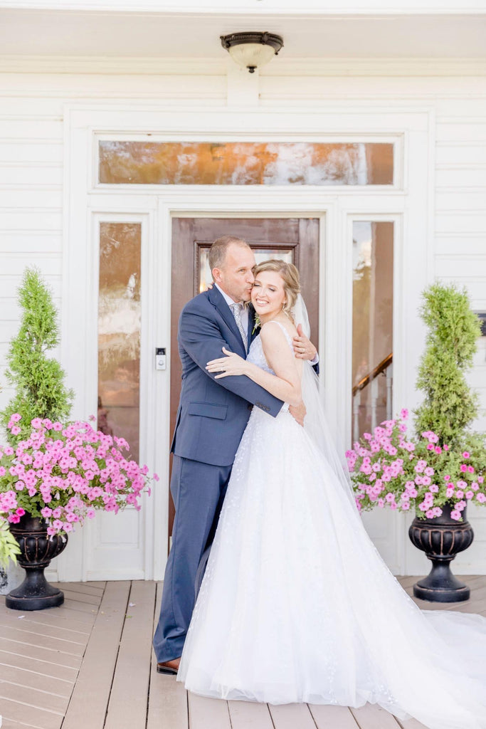 Hart Gown | A-line wedding dress with deep V neckline, delicate Ivory beading throughout bodice and skirt.