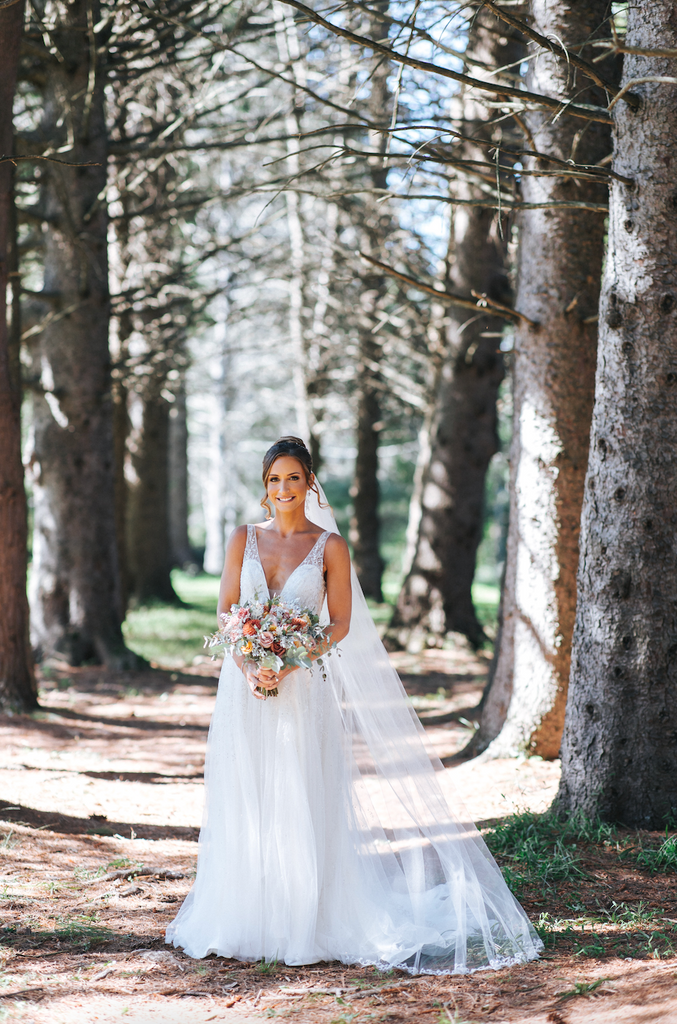 Meadown Gown | Deep V-neck A-line wedding dress with delicate bead work on bodice cascading onto skirt