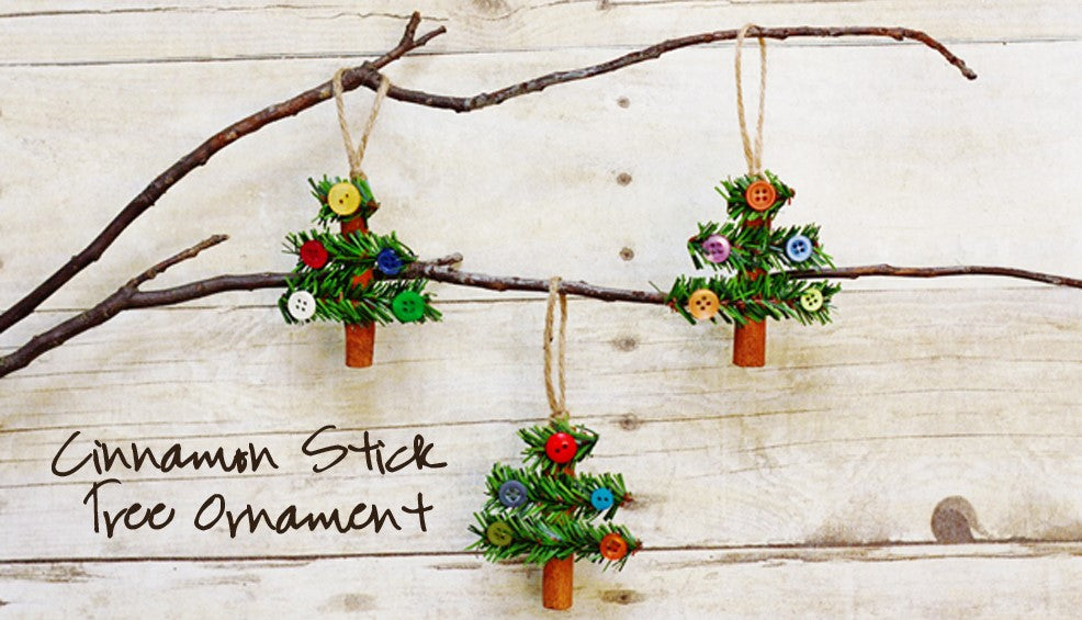 Cinnamon stick Christmas ornaments with pine garlands.