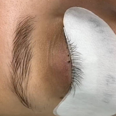 Tape back method eyelash extensions