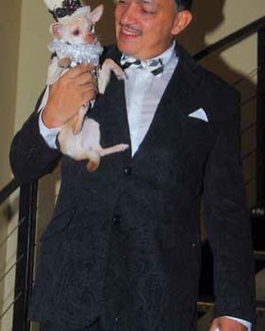 Designer Anthony Rubio posing with pup Kimba 