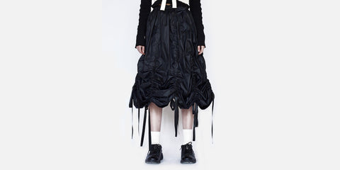 Museum of Friendship 'Drawstrip Skirt'<br> 'Year': 2017 – 'Material': 100% Polyester – 'Made in': China – 'Brand': Museum of Friendship is a London based brand that launched in 2014. It was founded by Tianmo Wang, a Central Saint Martins graduate, who became the second runner up of the LOreal prize