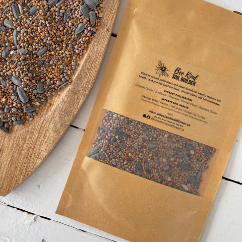 Wheat and Wildflower Bee Kind Soil Builder Regenerative Seed Blend in a tray and a kraft paper package