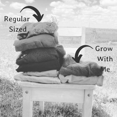 One garment of grow with me clothing replaces three regular sized items.  Image shows a stack of 3 pairs of pants and three shirts under a label regular sized  And under a label Grow With Me shows one pair of pants and one shirt.  Grow With Me Clothing is a sustainable clothing solution for children.