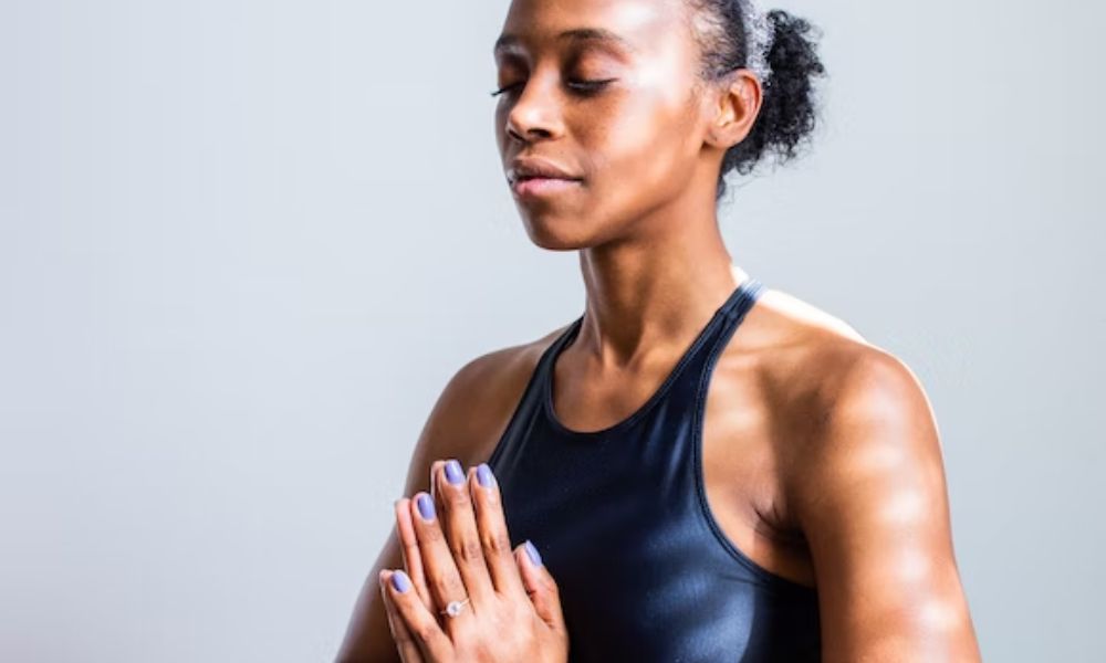 woman performing breathing exercises to reduce stress and manage seborrheic dermatitis