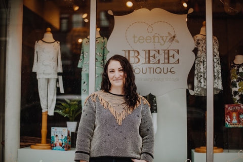 Kristie Case, founder of Teeny Bee Boutique, stands in front of her shop.