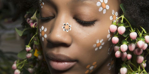 woman with flowers on face