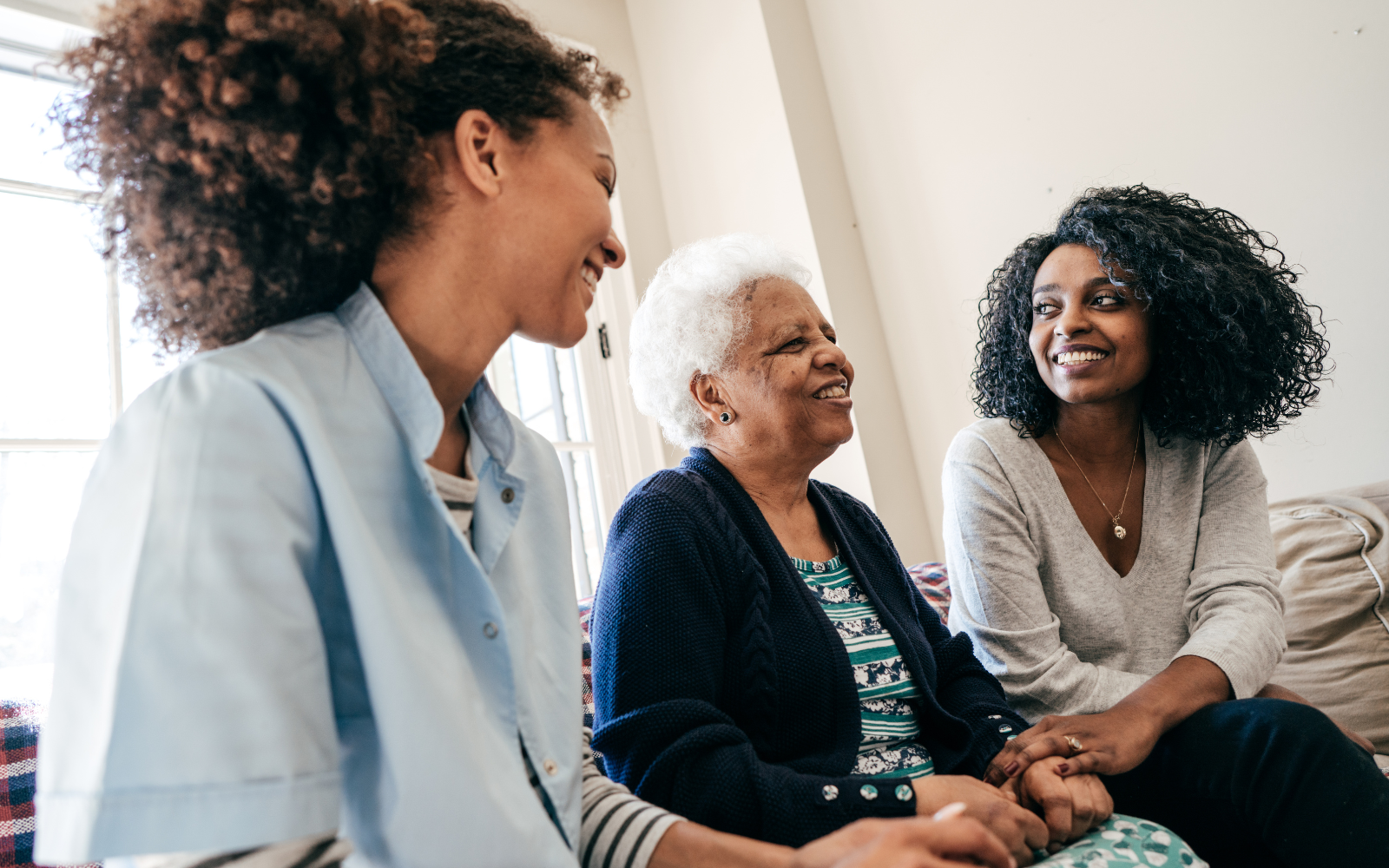 Family visiting their grandmother in a nursing home