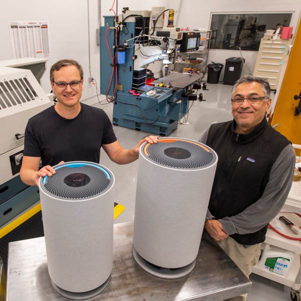 Peter of Oransi (left) and Moe of Aviemore (right) with Oransi air purifiers after company merger