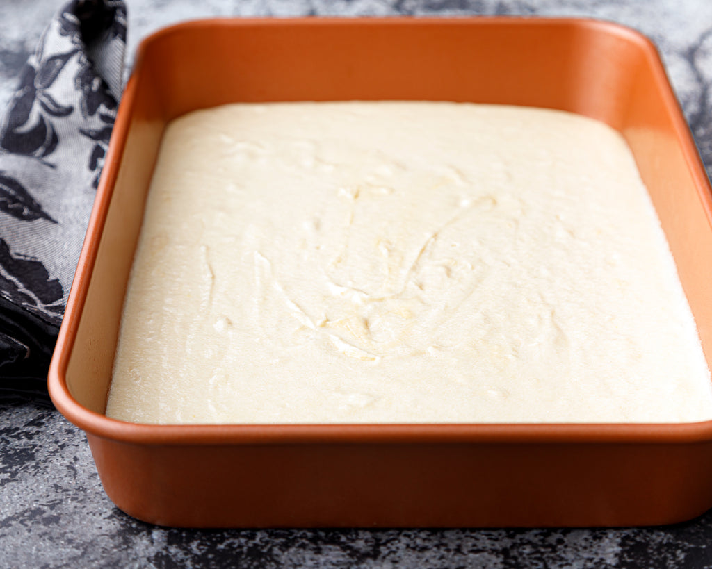 The finished cake batter in a 13x9-inch baking dish
