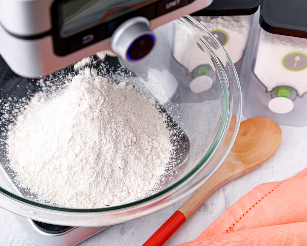 Using the PantryChic to dispense flour into a mixing bowl