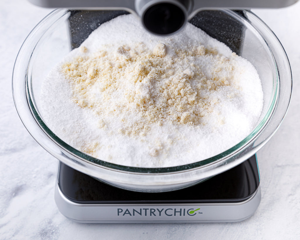 Dispensing the dry ingredients into a mixing bowl