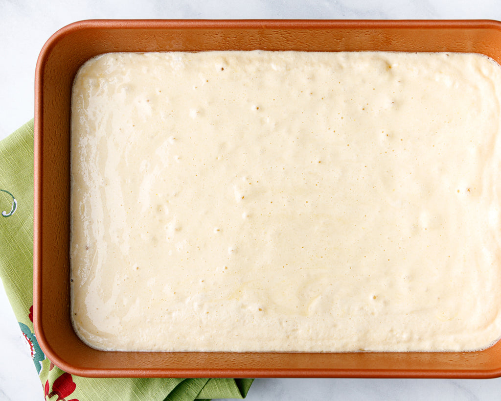 The cake batter in a a 13x9-inch baking dish