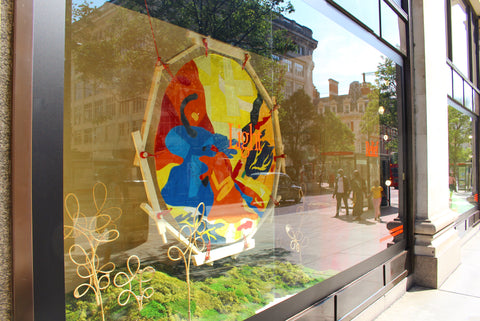 Bethany Williams sun artwork in the window of selfridges oxford street London 