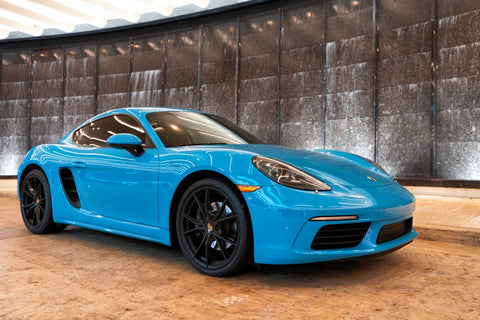 blue porsche 718 cayman model car