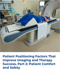 A woman lying down in the bed of a CT machine with her legs positioned using a foam wedge.