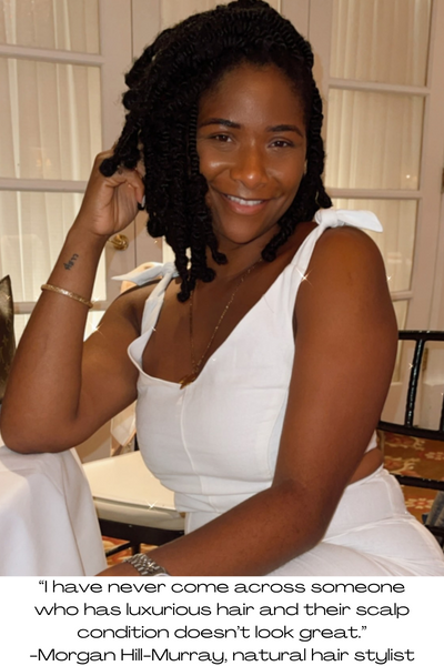 Morgan looks glamorous in a white outfit. She explains that luxurious hair requires a healthy scalp