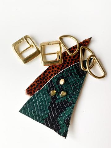 Golden accoutrements, leather in reptile tones and brown print