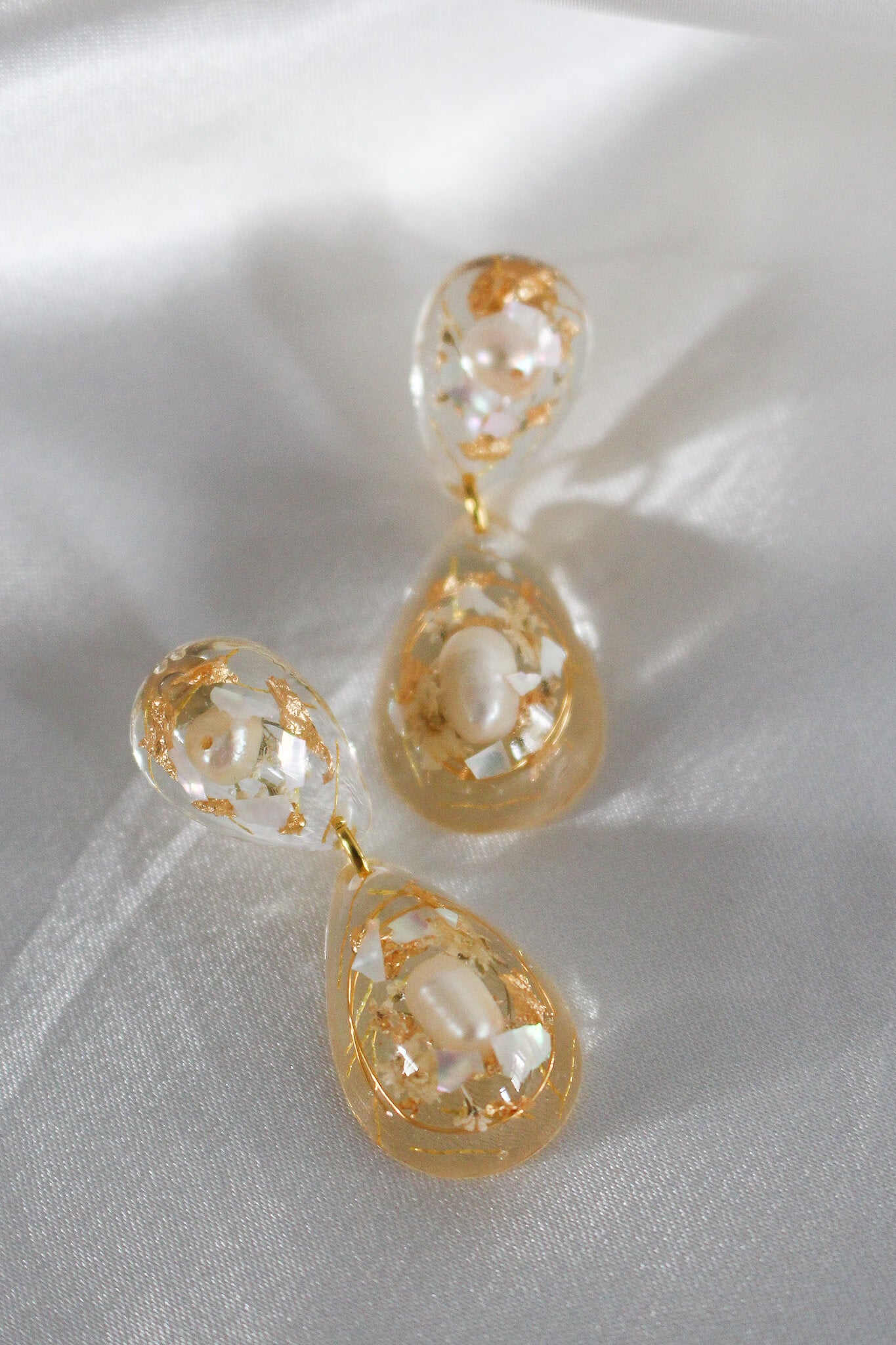 Handmade resin earrings, with pearl and gold flakes embedded