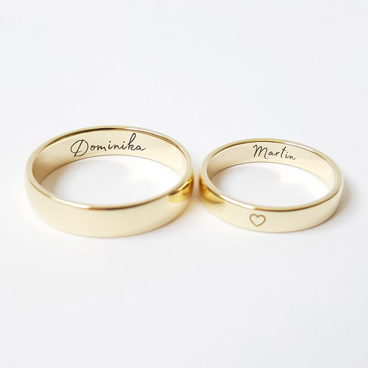 Personalized wedding rings engraving names and characters.