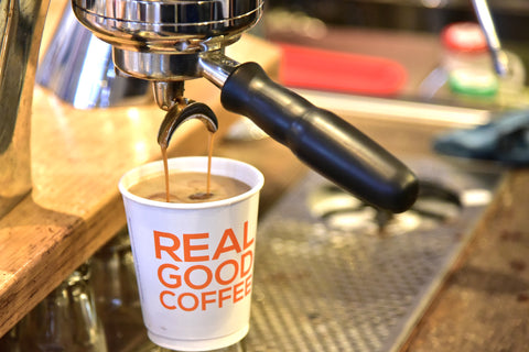 Modbar espresso pouring into compass coffee cup