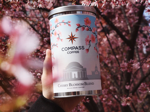 Cherry Blossom tin in front of cherry blossom trees