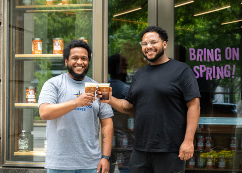 Miles and Sam at a cafe drinking Cold Brew