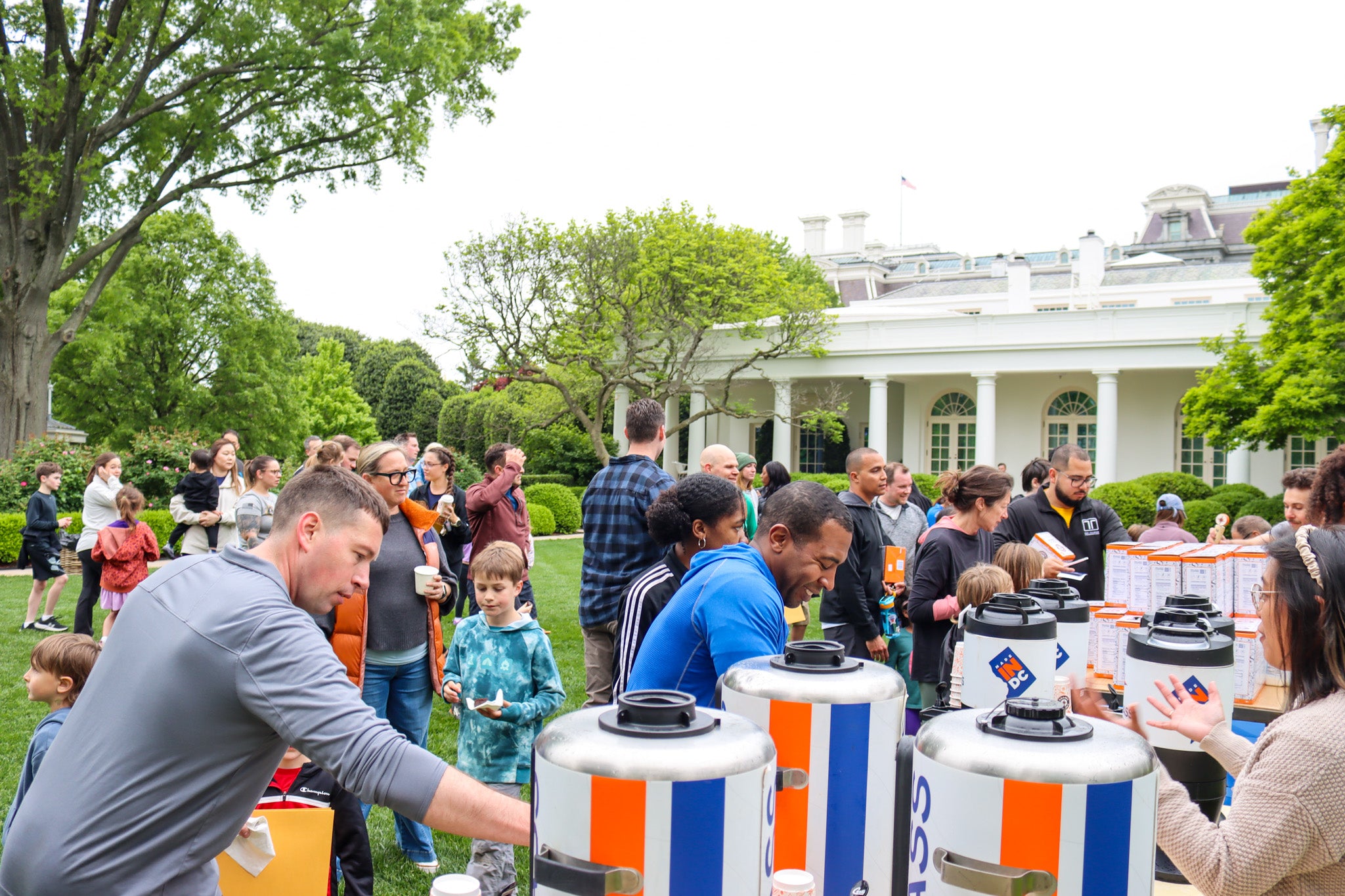 Military families and kids enjoy compass coffee on the White House South Lawn