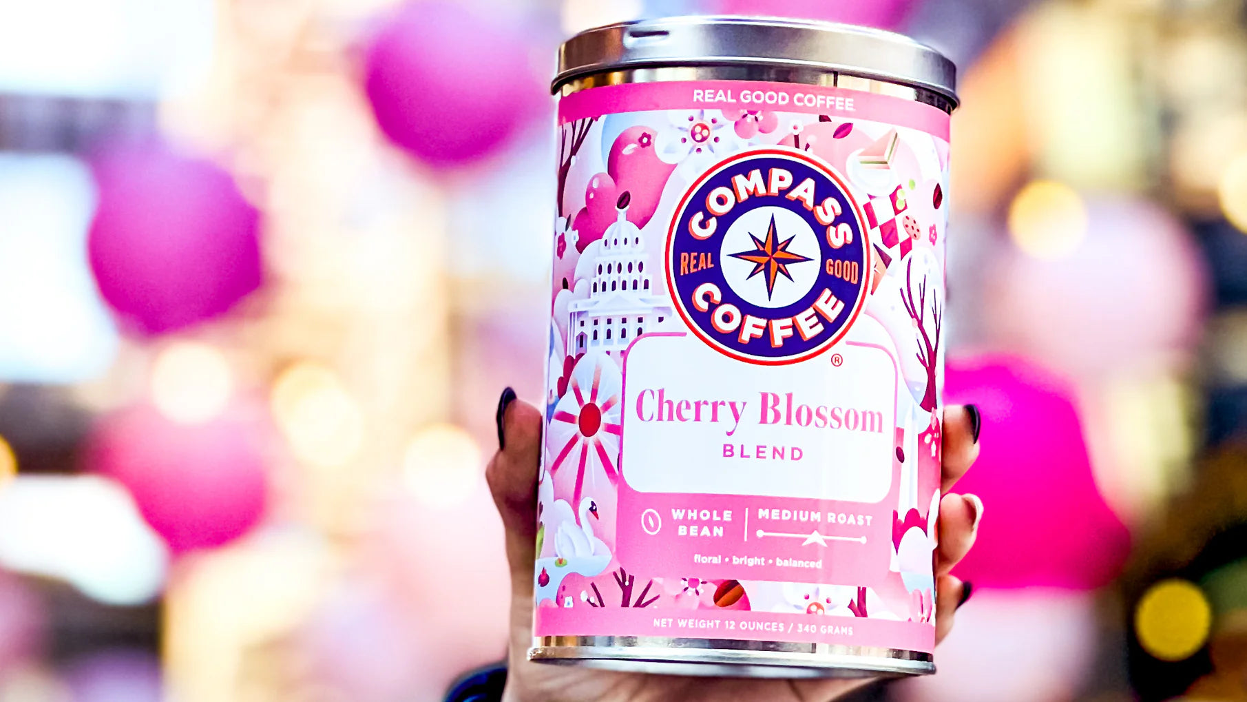 A tin of Compass Coffee Cherry Blossom Blend.