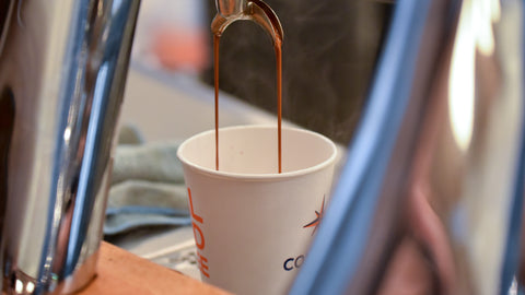espresso pouring into mug
