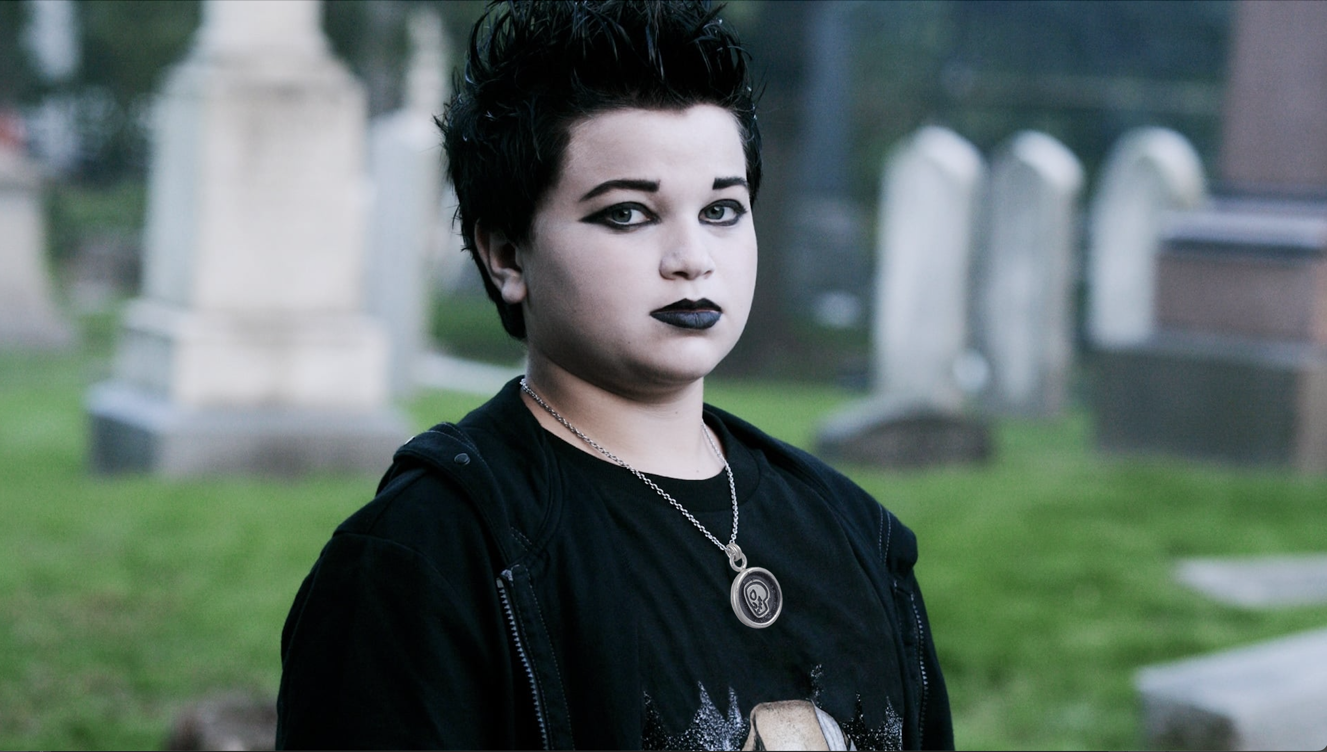 Soprano's Goth Kid, Little V, in cemetery meme. Vito Spatafore Jr. wearing Lauren Anabela's Memento Mori Skull Pendant