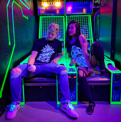 Smac and Myo Than posing at Glitch Arcade bar in Ft Lauderdale in SkinnyBuddha Clothing