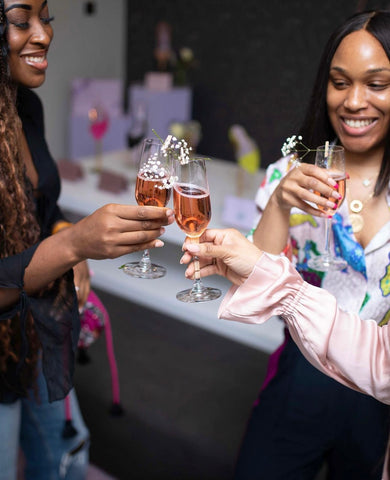 guests enjoying a toast at the Titi Adesa shoe party at the Lotte Accra 