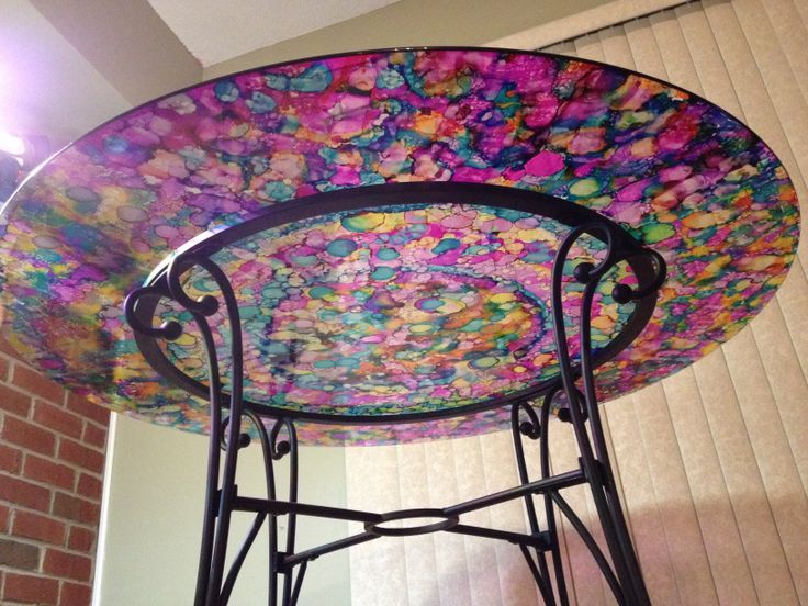 glass table painted with alcohol ink