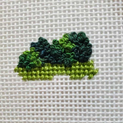 French knots stitched in a variegated needlepoint thread