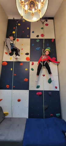 kids playing on a home climbing wall