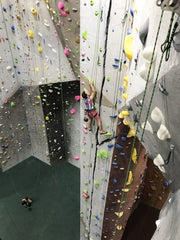 A man climbs one of over a dozen continuous climbable cracks in the ProjectRock Climbing Gym in Oakland Park, FL, near Ft. Lauderdale, FL.