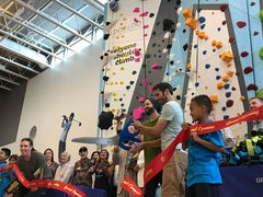 Cutting the ribbon for the opening of the 1Climb VBGC Climbing Wall