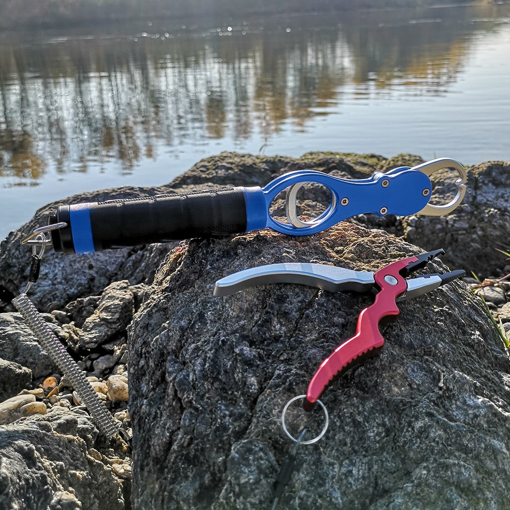 Fishing pliers and grips in red and blue