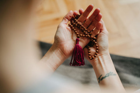 Practicing Japa mala technique with Sandal wood Mala from LEELA