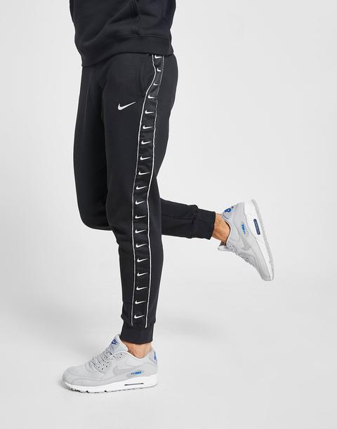 nike poly tape track pants