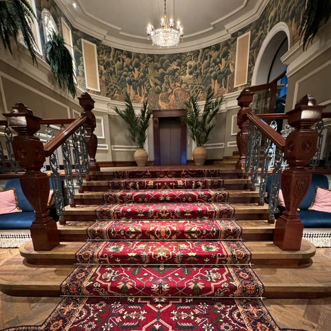 Slieve Donard lobby staircase with Victorian inspired wall coverings and carpet