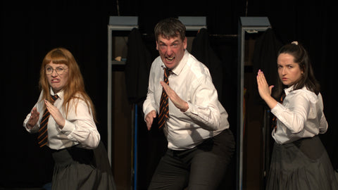 Teechers production photo of 3 actors on stage.