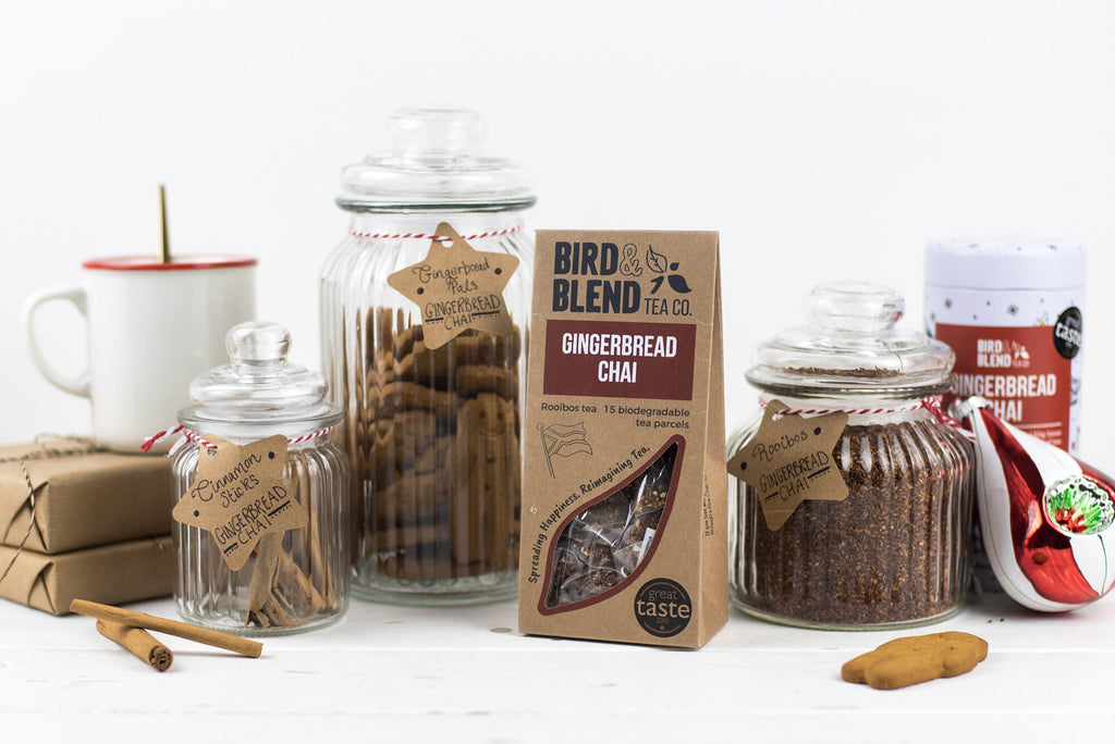 A packet of Gingerbread Chai tea and jars of gingerbread biscuits.