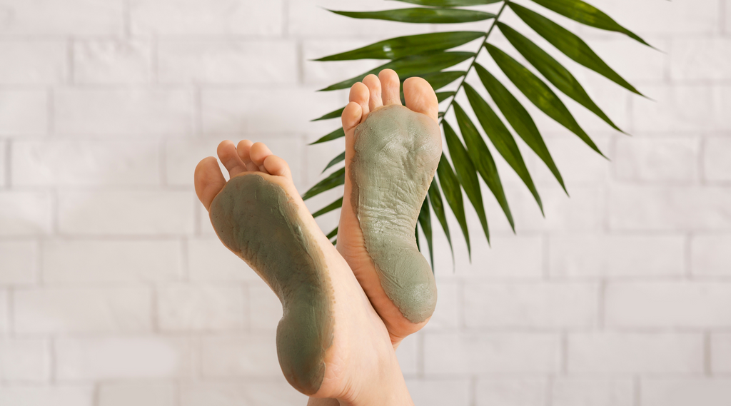 Feet with green clay mask