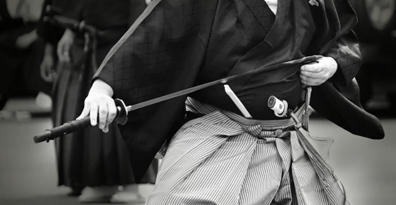 Sheathing Japanese sword katana in Iaido performance
