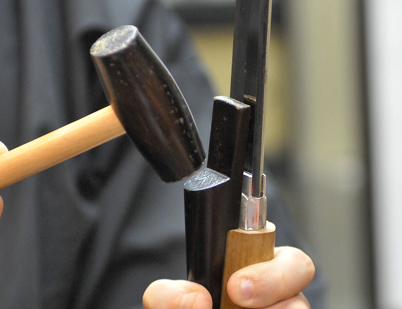 Using a mallet to remove Japanese sword blade from Tsuka