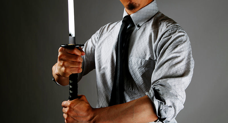 A business man with Japanese sword